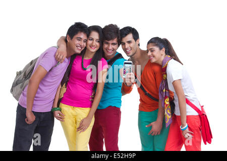 Happy university friends taking picture of themselves on white background Stock Photo