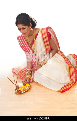 Bengali woman sitting with puja thali Stock Photo