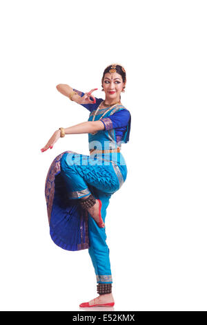 Full length of beautiful Bharatanatyam dancer performing on white background Stock Photo