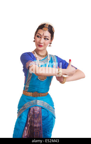 Dancer performing Bharatanatyam against white background Stock Photo