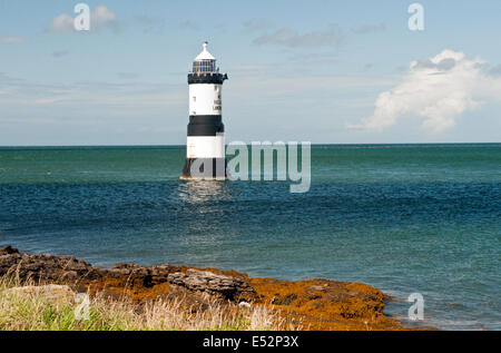 Penmon or Trwyn Du Lighthouse off Penmon Point on the coast of Anglesey, North Wales Stock Photo