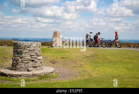 Mountain bikers taking a breather on the summit of Pole Bank on the Long Mynd near Church Stretton in Shropshire UK Stock Photo