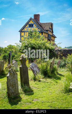 The timbered gatehouse at Stokesay Castle near Ludlow Shropshire UK from the church grounds