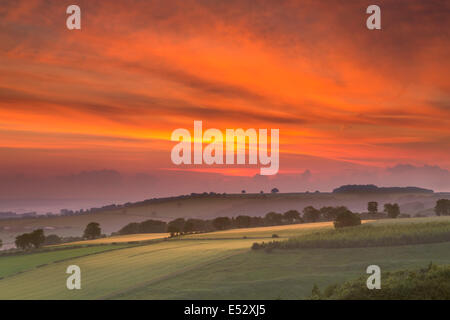 Sunset over the Vale of York from Thixendale on the edge of the East Yorkshire Wolds in mid-summer. Stock Photo
