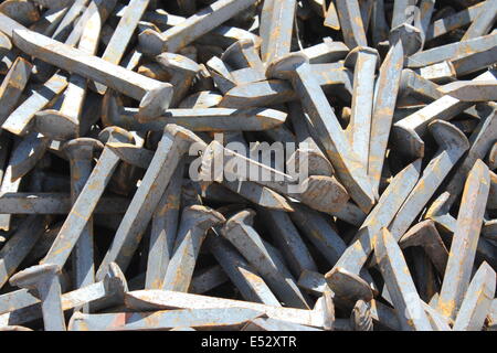 A pile of railroad spikes near Ancho, New Mexico Stock Photo