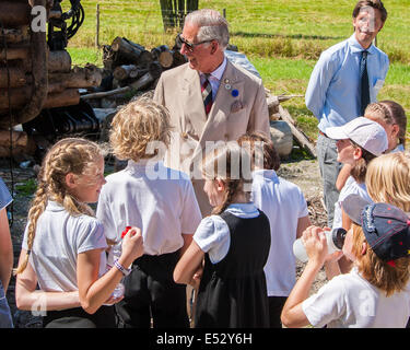 Wiston, West Sussex, UK. 18th July, 2014. HRH Prince Charles learns about the biofuel boiler at Wiston House, where he chatted to estate staff and children from local Steyning Primary School. Year 5 are taking part in a ‘Chef on the Farm’ day organised by Countryside Classroom. The organisation helps children to connect with where their food comes from. The children work with the gardener to source fresh produce, meet the farmers who rear the sheep, and cook with an expert chef before sitting down together to share the meal they have produced. Credit:  Julia Claxton/Alamy Live News Stock Photo