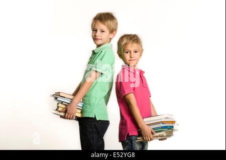 young brothers holding books Stock Photo