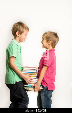 young brothers holding books Stock Photo