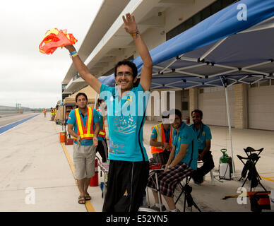 Austin, TX, US. 18th July, 2014. Iranian students from Qazvin Islamic Azad University cheer when their car Qiau Havin 2, makes it up a hill on the second day of qualifying races of the American Solar Challenge. The 1700-mile, eight day race from Austin, TX to Minneapolis, MN features veteran college teams from the U.S. and Canada. Credit:  Bob Daemmrich/Alamy Live News Stock Photo