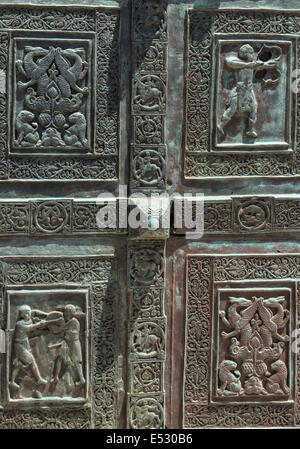 Detail of  panels on the bronze doors to The 12th century romanesque Cathedral at Trani, Puglia, Southern Italy. Stock Photo