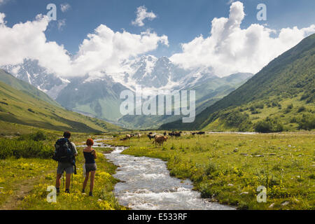 Russian trekkers on their way to Shkara glacier. Svaneti, Georgia Stock Photo