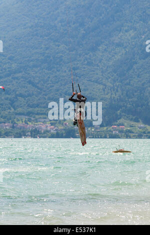 LAKE OF SANTA CROCE, ITALY - JULY 12: Professional kite-surfer demonstrating his ability 2014, July 12, 2014 Stock Photo