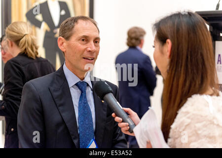 Sydney, Australia. 18th July, 2014. AUSTRALIA, Sydney: Guido Belgiorno-Nettis, President of the Trustees at the Art Gallery of NSW, is interviewed after the Archibald Prize winner announcement on July 18, 2014. Fiona Lowry won the prize for her portrait of prominent architect Penelope Seidler. The Archibald, Wynne and Sulman prize are major art prizes run by the Art Gallery of New South Wales with prizes of $75,000, $35,000 and $30,000 respectively. Credit:  MediaServicesAP/Alamy Live News Stock Photo