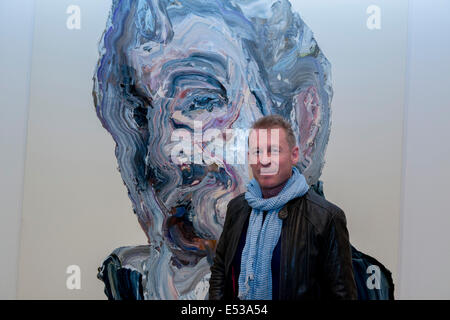 Sydney, Australia. 18th July, 2014. AUSTRALIA, Sydney. 18th July, 2014: Actor Richard Roxburgh infront of Artist Paul Ryan portrait of Richard. The Archibald, Wynne and Sulman prize are major art prizes run by the Art Gallery of New South Wales with prizes of $75,000, $35,000 and $30,000 respectively. Credit:  MediaServicesAP/Alamy Live News Stock Photo
