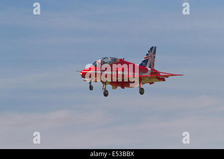 Farnborough, uk,18th July 2014, A red arrow coming in to land at the Farnborough Airshow 201 Credit: Keith Larby/Alamy Live News Stock Photo