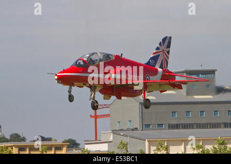 Farnborough, uk,18th July 2014, A red arrow coming in to land at the Farnborough Airshow 201 Credit: Keith Larby/Alamy Live News Stock Photo