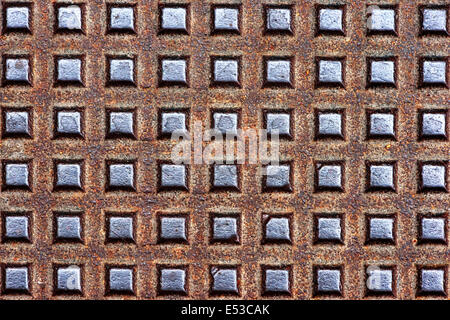 background of metallic textures on sewer manhole Stock Photo