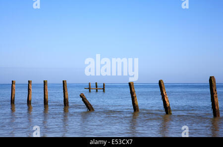 Remains of old abandoned sea defences at Cart Gap, near Happisburgh, Norfolk, England, United Kingdom. Stock Photo