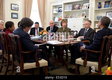 US President Barack Obama drops by National Security Advisor Susan E. Rice's meeting with Catherine Ashton, European Union High Representative, in her West Wing Office at the White House May 6, 2014 in Washington, DC. Stock Photo