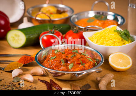 Indian food chicken jalfrezi curry in balti dish decoration set of vegetables Stock Photo