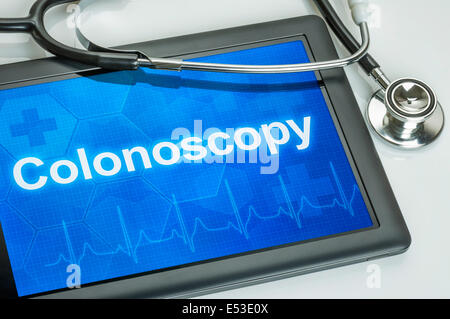 Tablet with the text Colonoscopy on the display Stock Photo