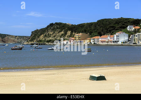 Beach and moored boats in the protected bay at Sao Martinho do Porto  Portugal Stock Photo