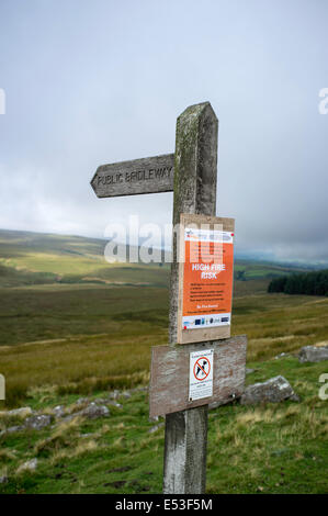 Warning sign of a high fire risk to upland countryside on a Bridleway sign, England, UK Stock Photo