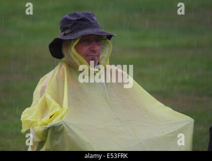 Nottingham, East Midlands, UK.  19th July 2014.  Dave from Derby braves torrential downpours and humidity at the annual Splendour music  festival at  Wollaton Hall, Nottingham. Credit:  Matthew Taylor/Alamy Live News Stock Photo
