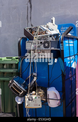 Recycling of old electronic goods tv, kettle, toaster, computer, telephone, at a rubbish dump on UCC campus, Cork, Ireland. Stock Photo