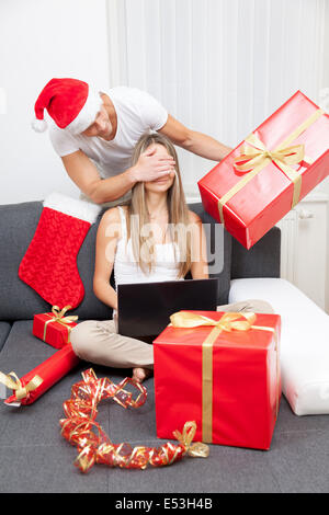 Happy couple exchanging gifts Stock Photo