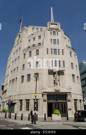 LONDON, ENGLAND  MAY 18, 2014:   BBC headquarters,  Broadcasting House,  London.  Television presenter Andrew Neil walking past. Stock Photo