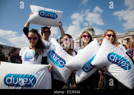 London, UK. Saturday 6th April 2013. Durex use the opportunity for some promotion at World Pillow Fight Day in London, UK. This flashmob event is organised by the Urban Playground Movement. A pillow fight flash mob is a social phenomenon of flash mobbing and shares many characteristics of a culture jam. Stock Photo