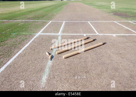 Cricket Pitch surface field wooden wickets and bails ready for game
