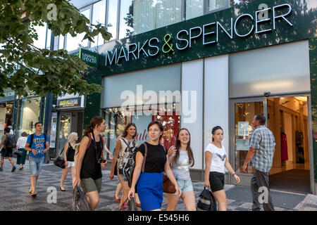 Tourists Prague shopping Wenceslas Square. Marks and Spencer store Prague, Czech Republic people shopping street pedestrians Stock Photo