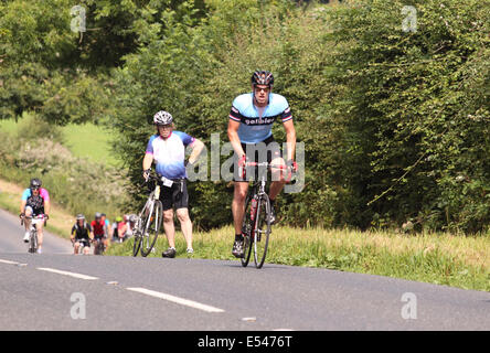 Mendip Hills, Somerset UK – Sunday 20th July 2014 – 1,000 cyclists took part in the Great Weston Ride cycling 56 miles from Bristol to Weston Super Mare via the Mendip Hills. Here riders struggle with the hills and the summer heat as they tackle the long climb at Burrington Combe raising money for Prostate Cancer UK Stock Photo