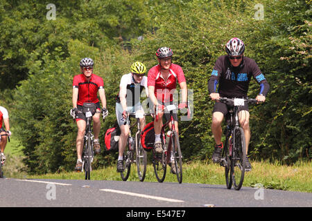 Mendip Hills, Somerset UK – Sunday 20th July 2014 – 1,000 cyclists took part in the Great Weston Ride cycling 56 miles from Bristol to Weston Super Mare via the Mendip Hills. Here riders struggle with the hills and the summer heat as they tackle the long climb at Burrington Combe raising money for Prostate Cancer UK Stock Photo