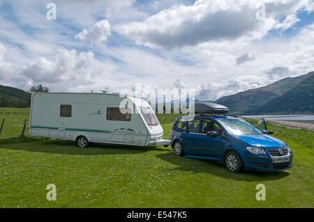 Caravan and car on a small caravan site at Onich, Lochaber, Highland, Scotland, UK Stock Photo