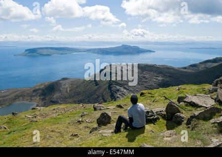 The Isle of Eigg from the summit of Hallival in the Rum Cuillin hills, Isle of Rum, Scotland, UK Stock Photo