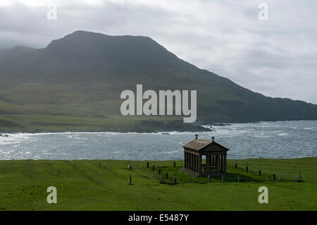 The Bullough Mausoleum and the peak of Ruinsival in the Rum Cuillin hills, Harris Bay, Isle of Rum, Scotland, UK. Stock Photo