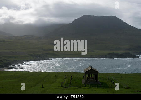 The Bullough Mausoleum and the peak of Ruinsival in the Rum Cuillin hills, Harris Bay, Isle of Rum, Scotland, UK. Stock Photo