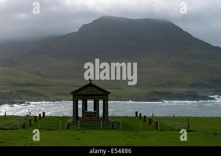 The Bullough Mausoleum and the peak of Ruinsival in the Rum Cuillin hills, Harris Bay, Isle of Rum, Scotland, UK. Stock Photo