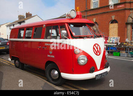 1965 60s red split screen VW Volkswagen 1493cc; 1960s  GERMAN FIRE BUS in Fleetwood, Lancashire, 20th July, 2014. Emergency vehicle, rescue firefighter, safety, engine, red fire truck, transportation, equipment, transport, fireman, danger, department, service, old german firetruck, at the Fleetwood Festival of Transport. Stock Photo