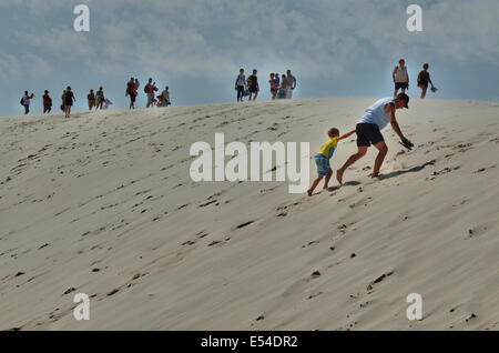 Leba, Poland. 20th, July 2014. Moving sand dunes in the Slowinski National Park between Leba and Rowy in Northern Poland at the Baltic sea coast. As waves and wind carry sand inland the dunes slowly move, at a speed of 3 to 10 meters per year. Some dunes are quite high - up to 30 meters. The moving dunes are regarded as a curiosity of nature on a European scale. Credit:  Michal Fludra/Alamy Live News Stock Photo