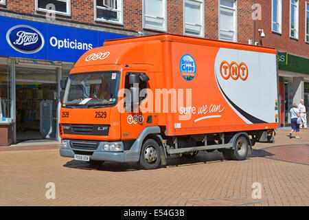 TNT low emission delivery lorry permitted to use pedestrianised shopping high street Stock Photo