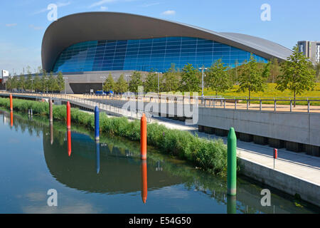 Waterworks River reflections & riverside Aquatics Centre roof by architect Zaha Hadid at Queen Elizabeth Olympic Park Stratford Newham East London UK Stock Photo