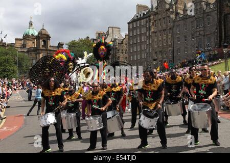 Edinburgh, Britain. 20th July, 2014. Performers take part in the 2014 Edinburgh Festival Carnival in Edinburgh, Britain, July 20, 2014. A grand parade of cultural performances including dragon and lion dancing, drum performances and jazz music on Sunday opened the 2014 Edinburgh Festival Carnival on Princes Street and in Princes Street Gardens at the city center. Credit:  Guo Chunju/Xinhua/Alamy Live News Stock Photo