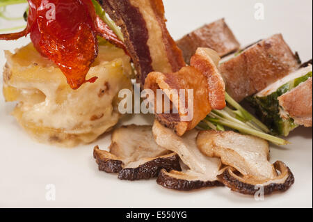 Mushrooms with bacon and rabbit meat Stock Photo