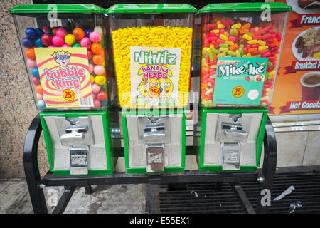 Candy dispensers outside a deli in the New York neighborhood of Chelsea Saturday, July 19, 2014. (© Richard B. Levine) Stock Photo