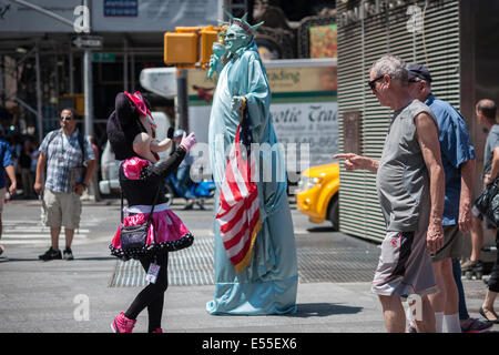 Costumed characters swarm Times Square in New York on Friday, July 18, 2014. Stock Photo
