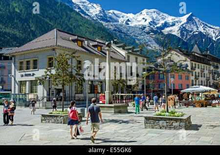 Place Balmat in the centre of Chamonix with Les Bossons Glacier and Mont Blanc in the distance. Stock Photo